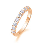 Rose gold ring with diamonds on a white background