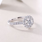 Silver ring with a diamond on a light background