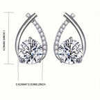 Pair of silver earrings with clear gemstones, shown with measurements on a white background.