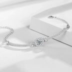 Silver bracelet with a diamond-like gem on a white background