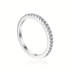 Silver ring with small diamonds on a white background