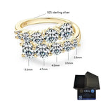 Gold ring with diamonds and dimensions labeled on a white background