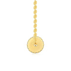 Gold necklace with a round pendant on a white background