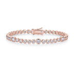 Rose gold bracelet with clear stones on a white background