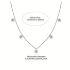 Silver necklace with moissanite stones on a white background