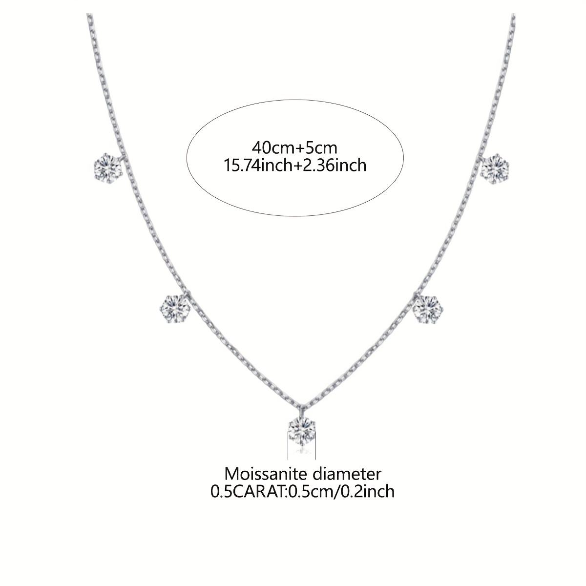 Silver necklace with moissanite stones on a white background
