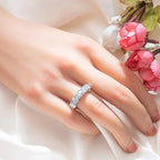 Silver ring on a hand with a soft focus background