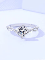 Silver ring with a large diamond on a light blue background