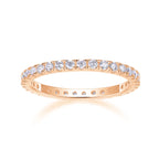 Rose gold ring with diamonds on a white background
