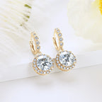 Gold hoop earrings with clear gemstones on a white background