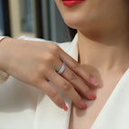 Close-up of a person wearing a ring on a blurred background