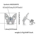 Butterfly-shaped silver earrings with synthetic moissanite details on a white background