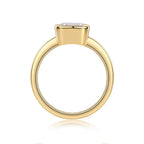 Gold ring with a diamond on a white background