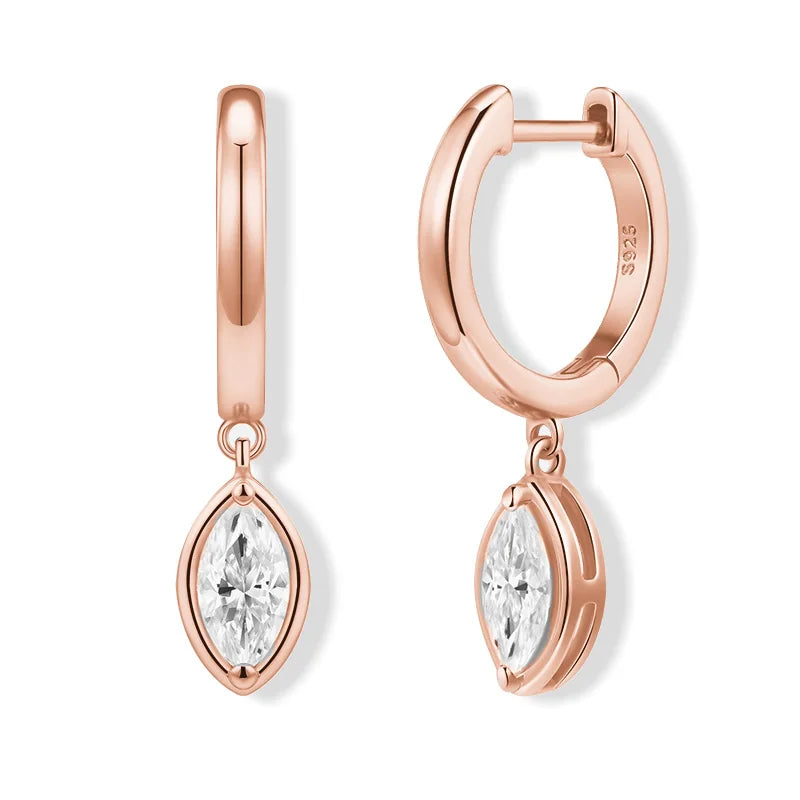 Rose gold hoop earrings with clear gemstones on a white background