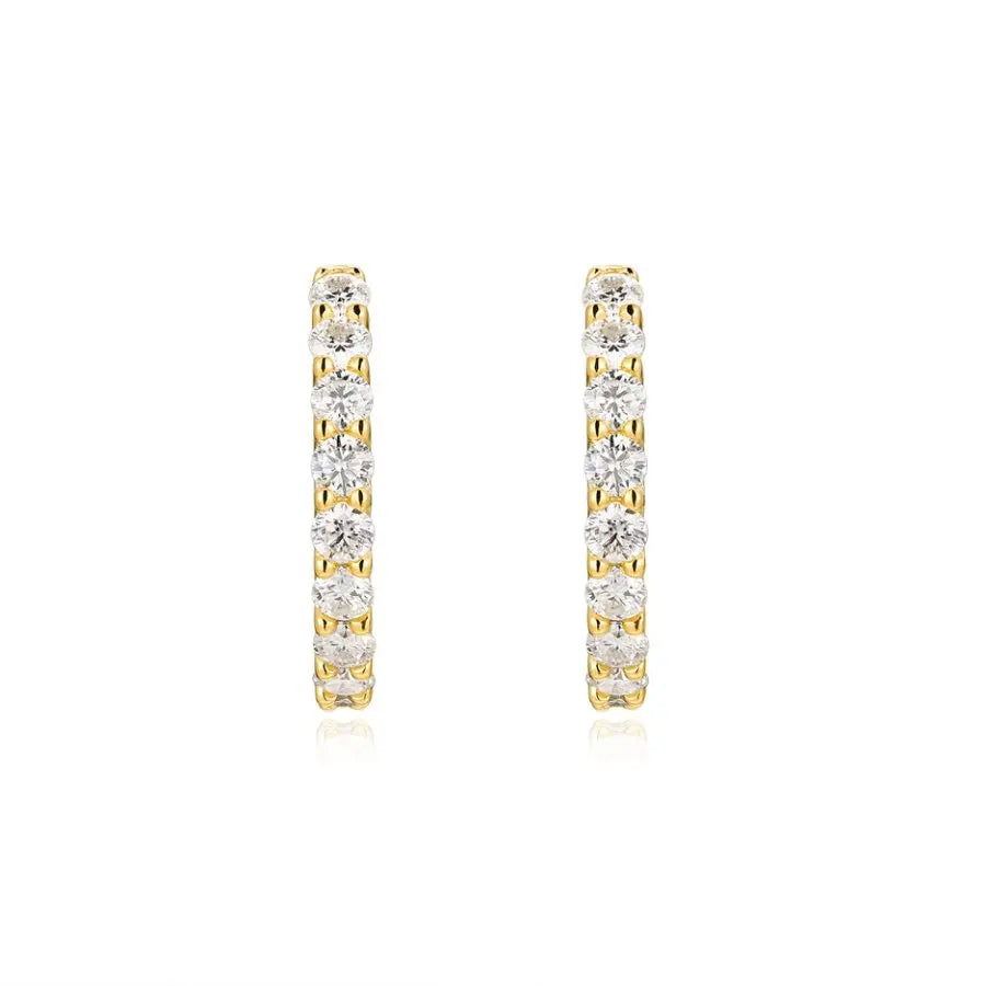 Gold hoop earrings with clear gemstones on a white background
