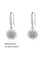 Silver earrings with moissanite stones on a white background
