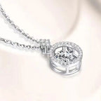 Silver necklace with a heart-shaped diamond pendant on a light background