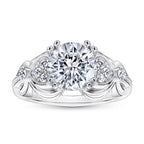 Silver ring with a large central diamond and smaller diamonds on the band against a white background