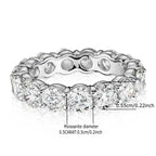 Silver ring with diamond-like stones and measurements on a white background