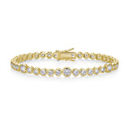 Gold bracelet with clear stones on a white background