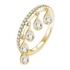 Gold ring with pavé moissanite band and teardrop moissanite drop accents on a white background