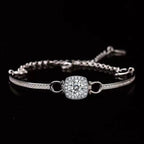 Silver bracelet with a diamond clasp on a black background