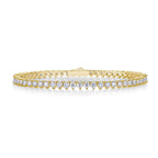 Yellow gold tennis bracelet with a continuous row of round brilliant stones on a white background
