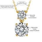 Gold necklace with two round moissanite pendants on a white background
