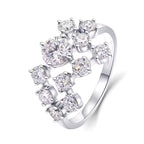 Silver ring with multiple diamonds on a white background