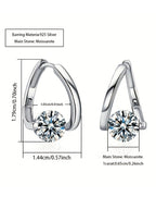 Silver earrings with moissanite stones and measurements on a white background