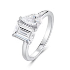 Silver ring with two prominent diamonds on a white background