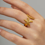 Adjustable starfish and seashell wrap ring worn on hand – tarnish-free beach jewelry