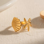 18k gold plated starfish and seashell ring styled with summer outfit – coastal jewelry