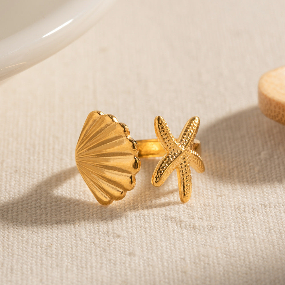 18k gold plated starfish and seashell ring styled with summer outfit – coastal jewelry