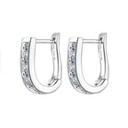 Pair of silver hoop earrings with embedded crystals on a white background