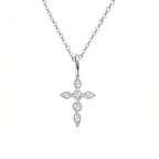 Silver cross pendant necklace on a white background