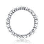 Silver ring with diamond accents on a white background