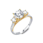 Gold and silver ring with three diamonds on a white background