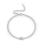 Silver bracelet with clear stones on a white background